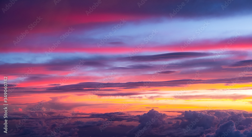 Fototapeta premium Sunset sky background vivid color sky background. view from plane.