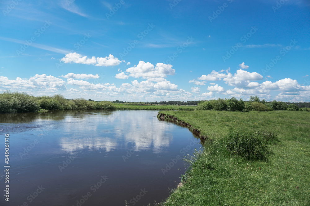 Beautiful spring river in the flowing nature. Colorful landscape in the morning and evening. Travel to deserted places of the world. Stock photo for design Beautiful spring river in the flowing nature. Colorful landscape in the morning and evening. Travel to deserted places of the world. Stock photo for design