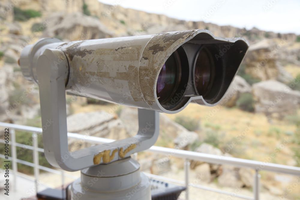 tourist binoculars at Gobustan . Stationary binoculars. gadgets at viewing Gobustan . big city binoculars. Watch with binoculars. panorama of the city. Tourist binocular . Gobustan National Park. tourist binoculars at Gobustan . Stationary binoculars. gadgets at viewing Gobustan . big city binoculars. Watch with binoculars. panorama of the city. Tourist binocular . Gobustan National Park.