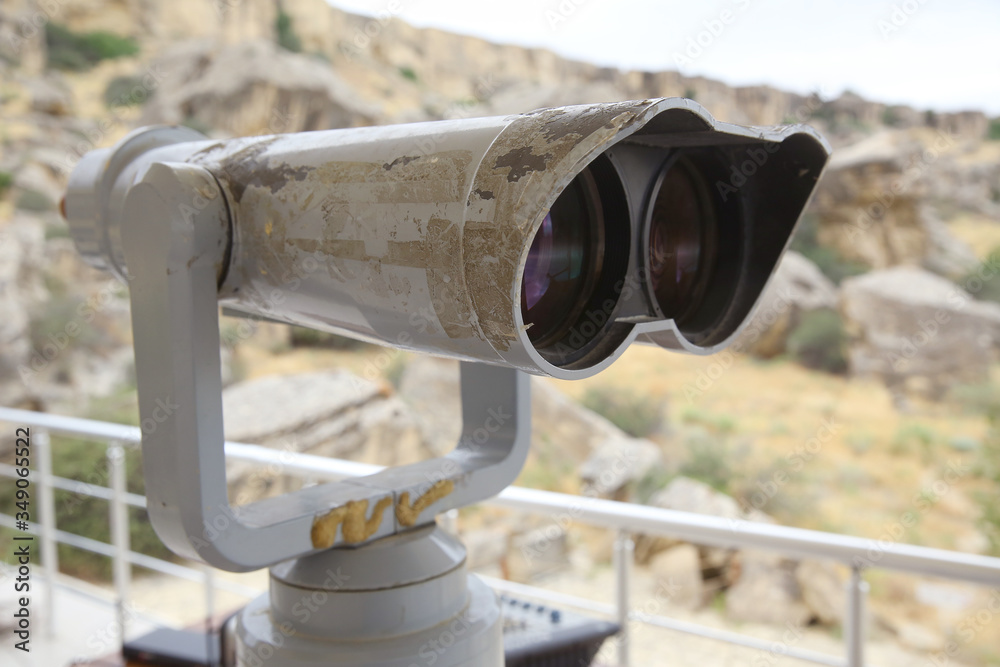 tourist binoculars at Gobustan . Stationary binoculars. gadgets at viewing Gobustan . big city binoculars. Watch with binoculars. panorama of the city. Tourist binocular . Gobustan National Park.