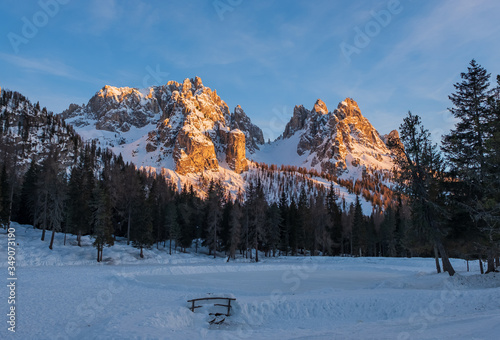 Tre Cime di Lavaredo Drei Zinnen seen from Antorno lake in Sexten Dolomites at sunset. Veneto, Italy. January 2020