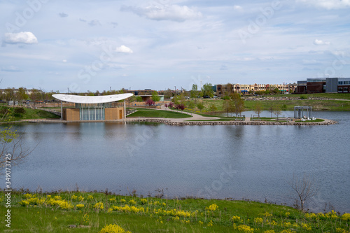 Принти на полотні Maple Grove, Minnesota - View of the Town Green park and community outdoor bands