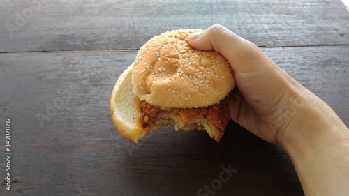 a bite mark on pork burger photo