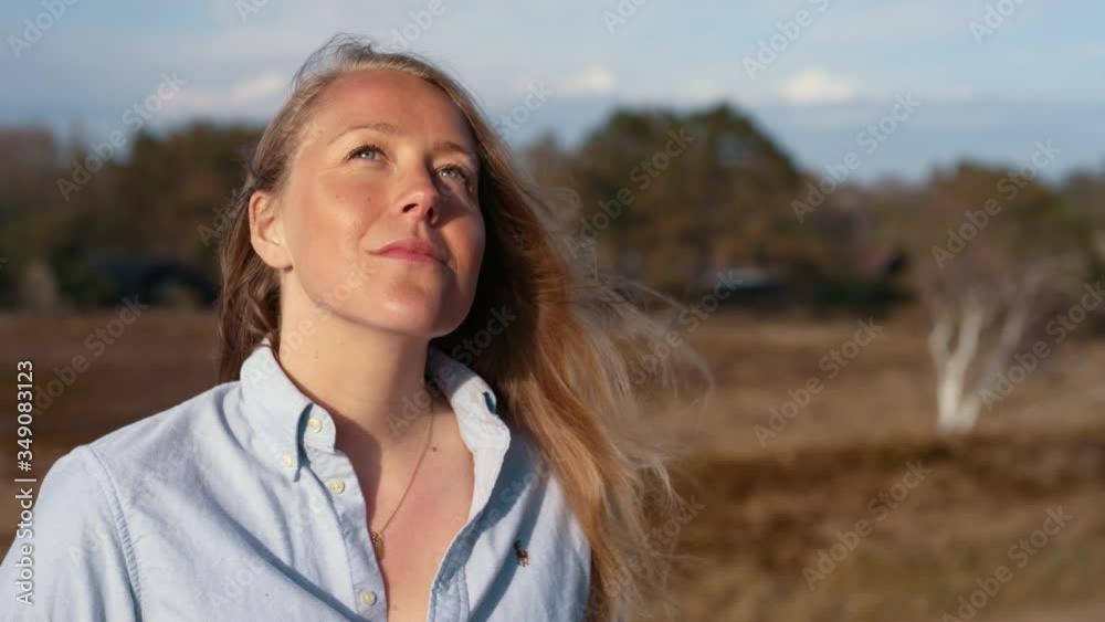 Caucasian young woman photographer takes analog camera photo and looks up, close up portrait Caucasian young woman photographer takes analog camera photo and looks up, close up portrait