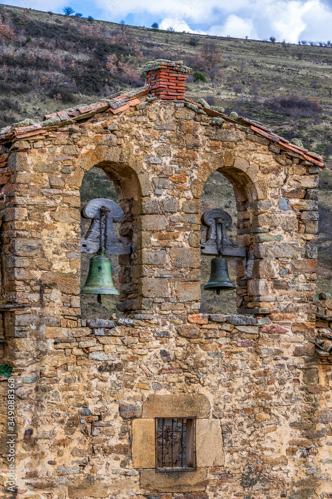 bells on a ruined and abandoned church tower in villages of depopulated spain