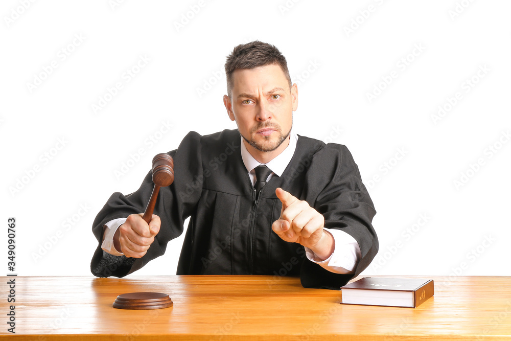 Strict male judge at table on white background Strict male judge at table on white background