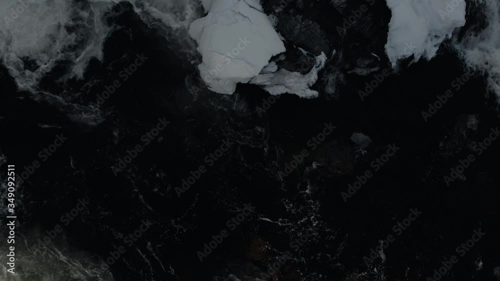 Frozen And Icy River Flowing Through St. Francis Dam in Sherbrooke, Quebec In Winter - aerial shot Frozen And Icy River Flowing Through St. Francis Dam in Sherbrooke, Quebec In Winter - aerial shot