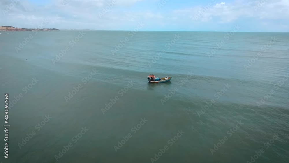 Lonely and single boat at Brazil's northeast Pipa beach.. Lonely and single boat at Brazil's northeast Pipa beach..