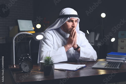 Arab businessman working in...