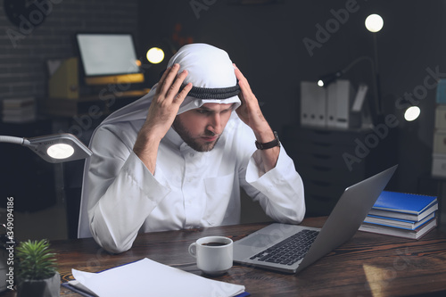 Tired Asian businessman wor...