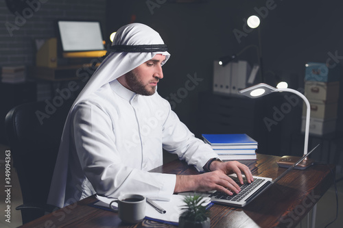 Arab businessman working in...