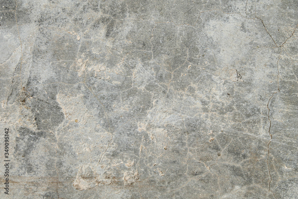 Cracked concrete texture. Faults and cracks on the stone surface.
