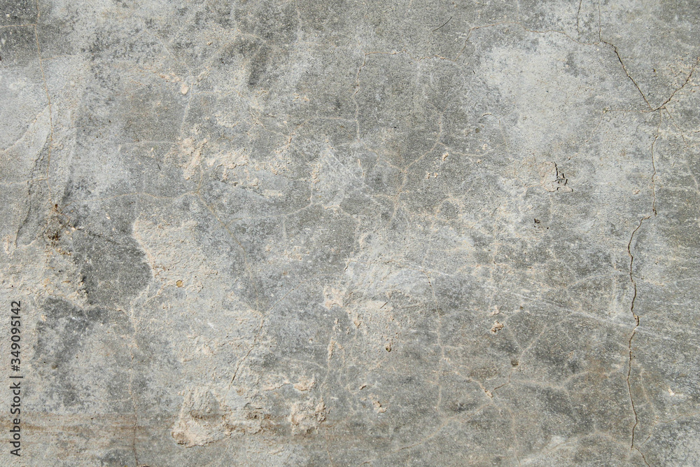Cracked concrete texture. Faults and cracks on the stone surface. Cracked concrete texture. Faults and cracks on the stone surface.