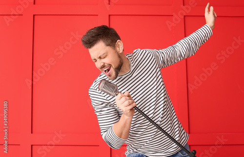Handsome man singing agains...