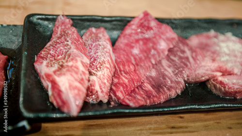 Wagyu beef raw sliced served for japanese barbecue of Sukiyaki. Yakiniku
