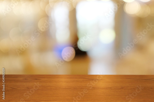 Top of empty of wood table with Blur Interior and decoration of a Modern loftBar and coffee. Using for Mock up template for craft display of your design Banner for advertise of product.