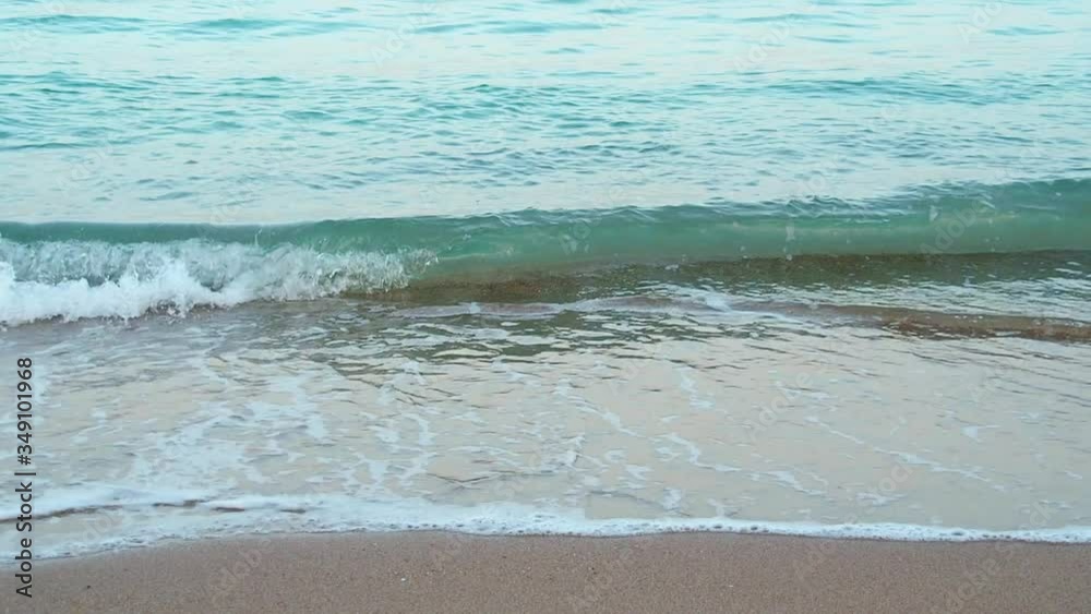 Red Sea waves running on brown sand beach, medium shot. Nature background. Photographed in Hurghada in february. Selective soft focus. Blurred background Red Sea waves running on brown sand beach, medium shot. Nature background. Photographed in Hurghada in february. Selective soft focus. Blurred background