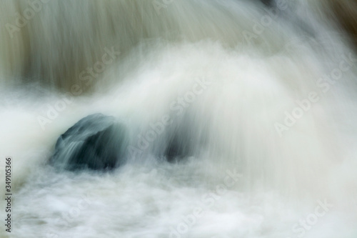 Silky water of Cargill Falls in Putnam  Connecticut in springtime.
