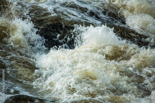 Turbulent water of Cargill Falls in Putnam, Connecticut in springtime.