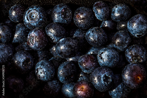 Fresh blueberry background. Texture blueberry berries close up wuth droplets