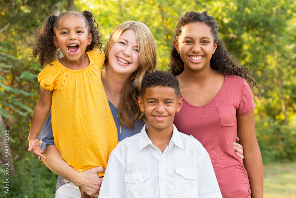 Portrait of a happy mixed race family smiling Portrait of a happy mixed race family smiling