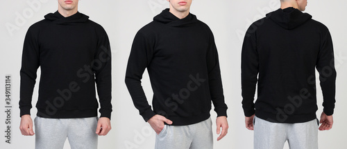 Man in black hooded sweatshirt on white background. Front view, back view
