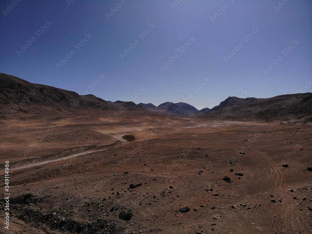 Naklejka premium Mountain road. White peaks. Dangerous cliffs. Pamir. Fast river. Rocks. Dangerous road. Roof of the world. Talikistan. Badakhshan.Traveling in the mountains. Afganistan.