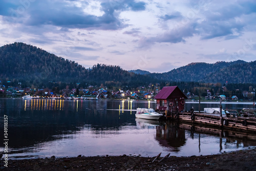 Lake wharf with a wooden pier at dawn. Teletskoye Lake, Artybash Village, Altai Republic, Russia photo