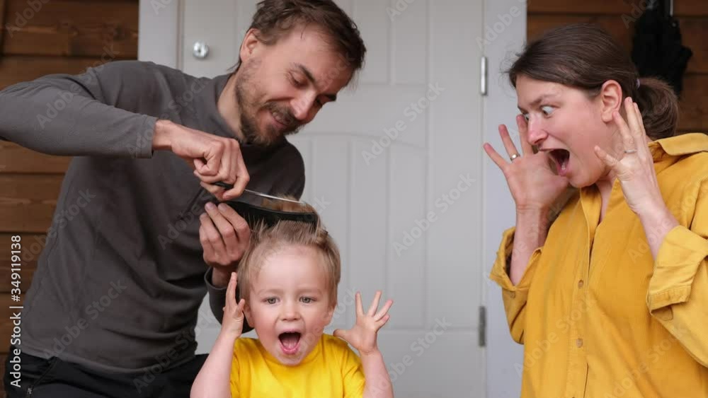 Family haircut at home during quarantine when closed all hairdressers. Father cut hair for son and mother is shocked by it. Beauty and selfcare at home, crazy lifestyle during lockdown. Stop motion.
