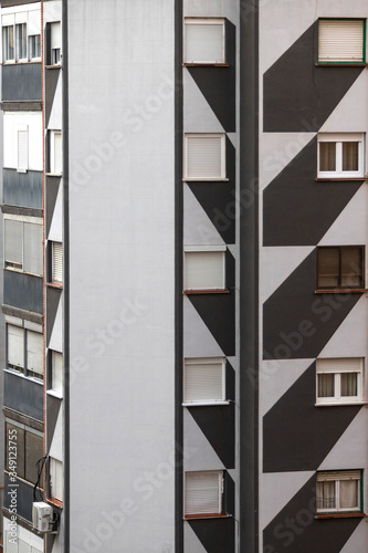 apartment building in european city with wall painted in gray tones