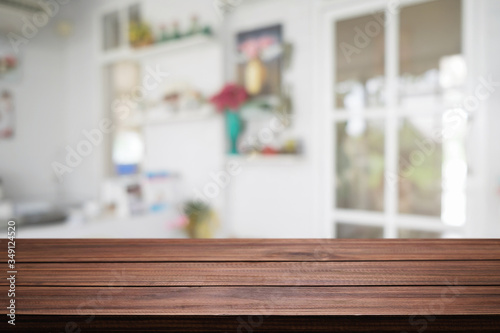 Wood desk space and blurred of kitchen background. for product display montage. business presentation. © qOppi