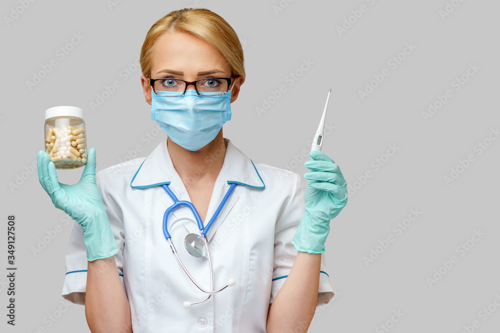 medical doctor nurse woman wearing protective mask and rubber or latex gloves - holding can of medicine and thermometer medical doctor nurse woman wearing protective mask and rubber or latex gloves - holding can of medicine and thermometer