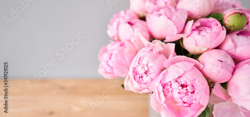 Fototapeta Naklejka Na Ścianę i Meble -  Elegant bouquet of a lot of peonies of pink color close up. Beautiful flower for any holiday. Lots of pretty and romantic flowers in floral shop. Flowers delivery