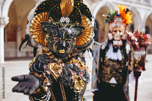 Portrait of a couple with beautiful masks in Venice, Italy