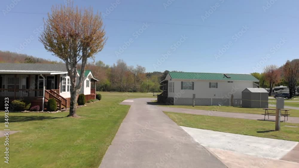 Traveling on cement pathway road in RV and motorhome campground, aerial
