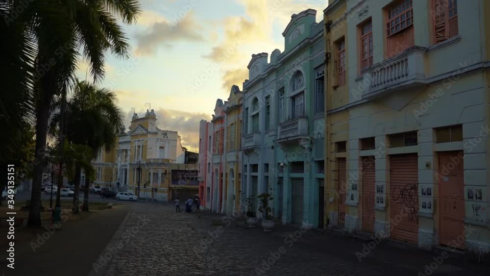 Tilt up of a cobblestone road with beautiful colorful old buildings in the center of Joao Pessoa, Brazil during a beautiful sunset on a warm summer evening Tilt up of a cobblestone road with beautiful colorful old buildings in the center of Joao Pessoa, Brazil during a beautiful sunset on a warm summer evening