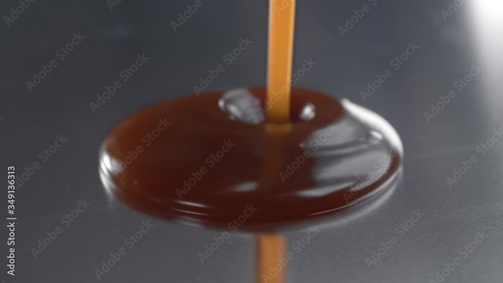salty melted caramel is poured to the metal surface in the kitchen salty melted caramel is poured to the metal surface in the kitchen