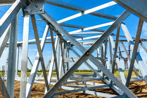 High voltage electric pillar from under. A high-voltage electricity tower