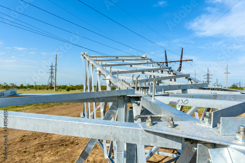 High voltage electric pillar from under. A high-voltage electricity tower