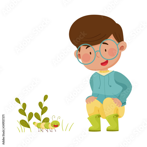 Little Boy Hunkering Down Exploring Worm Crawling on the Ground Vector Illustration