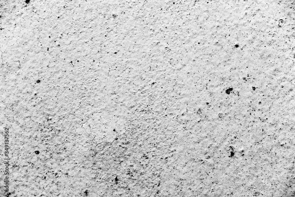 Texture of a concrete wall with cracks and scratches which can be used as a background Texture of a concrete wall with cracks and scratches which can be used as a background