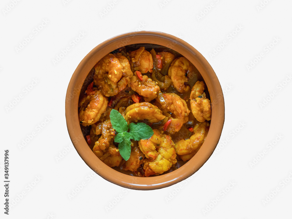 Isolated King Prawn Masala in a clay bowl. Traditional Indian cuisine Isolated King Prawn Masala in a clay bowl. Traditional Indian cuisine