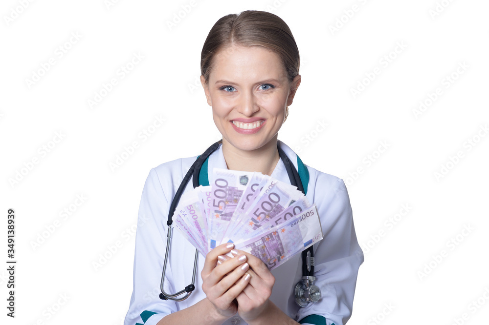 Female doctor holding money isolated on white background Female doctor holding money isolated on white background
