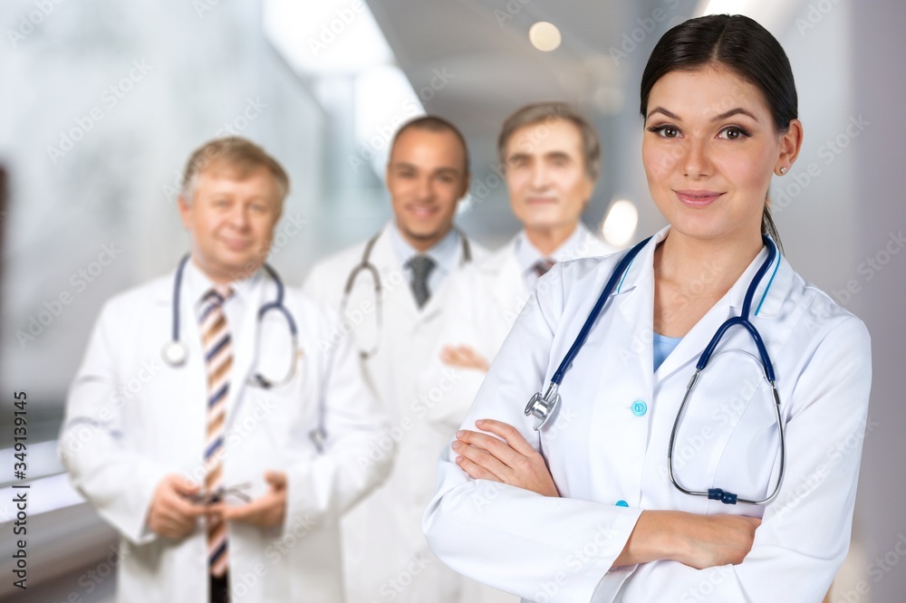 Group of doctors against the hospital background Group of doctors against the hospital background