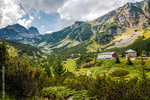 Beautiful summer mountain landscape in Rila mountain, Bulgaria. Mountain scenery and a mountain lodge.