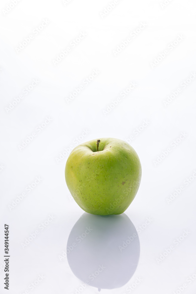 Ripe, green apples on a white background. Farm fruits Ripe, green apples on a white background. Farm fruits