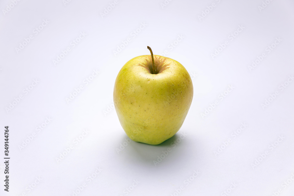 Ripe, green apples on a white background. Farm fruits