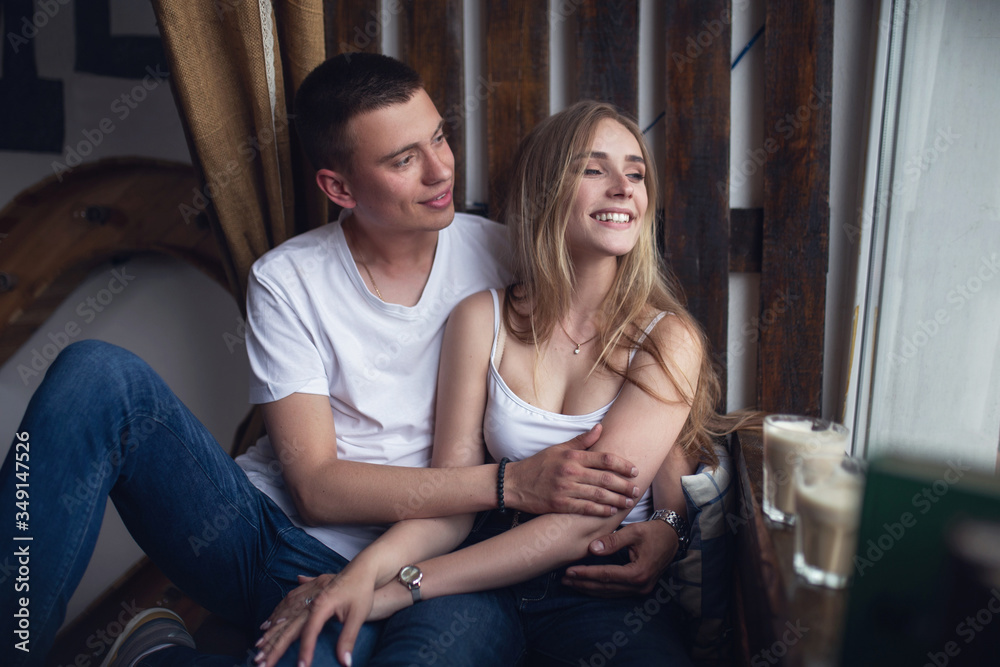 Surprise! Beautiful romantic couple in cafe. Young man is coming of the date to his beloved in caffe. Feel of happiness.