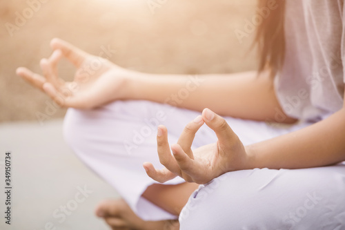  woman enjoying meditation and yoga in the park