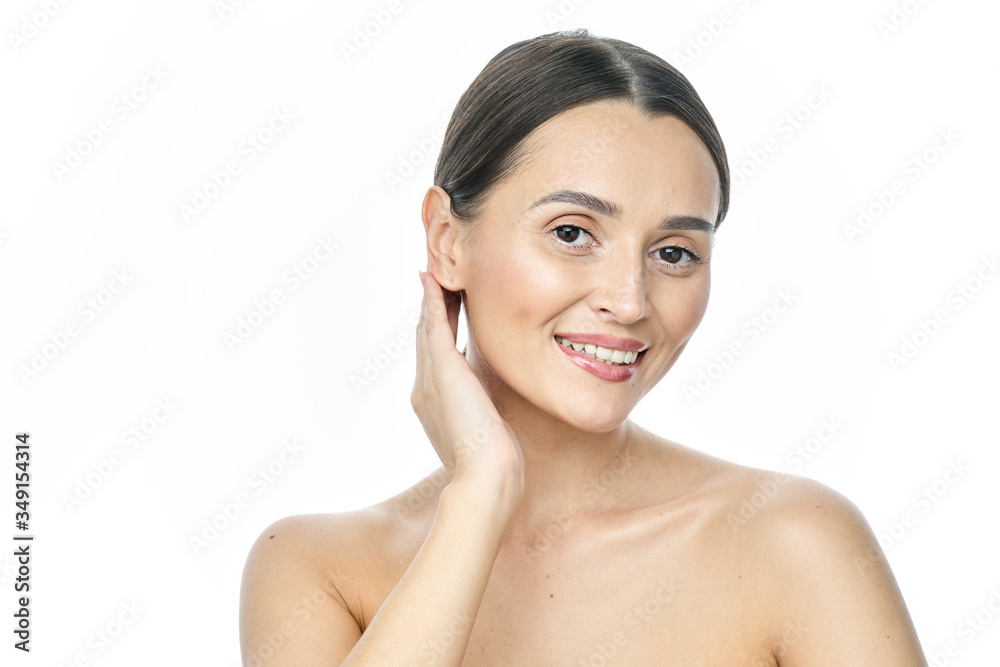 Beautiful smiling woman with clean skin, natural make-up, and white teeth on white background Beautiful smiling woman with clean skin, natural make-up, and white teeth on white background